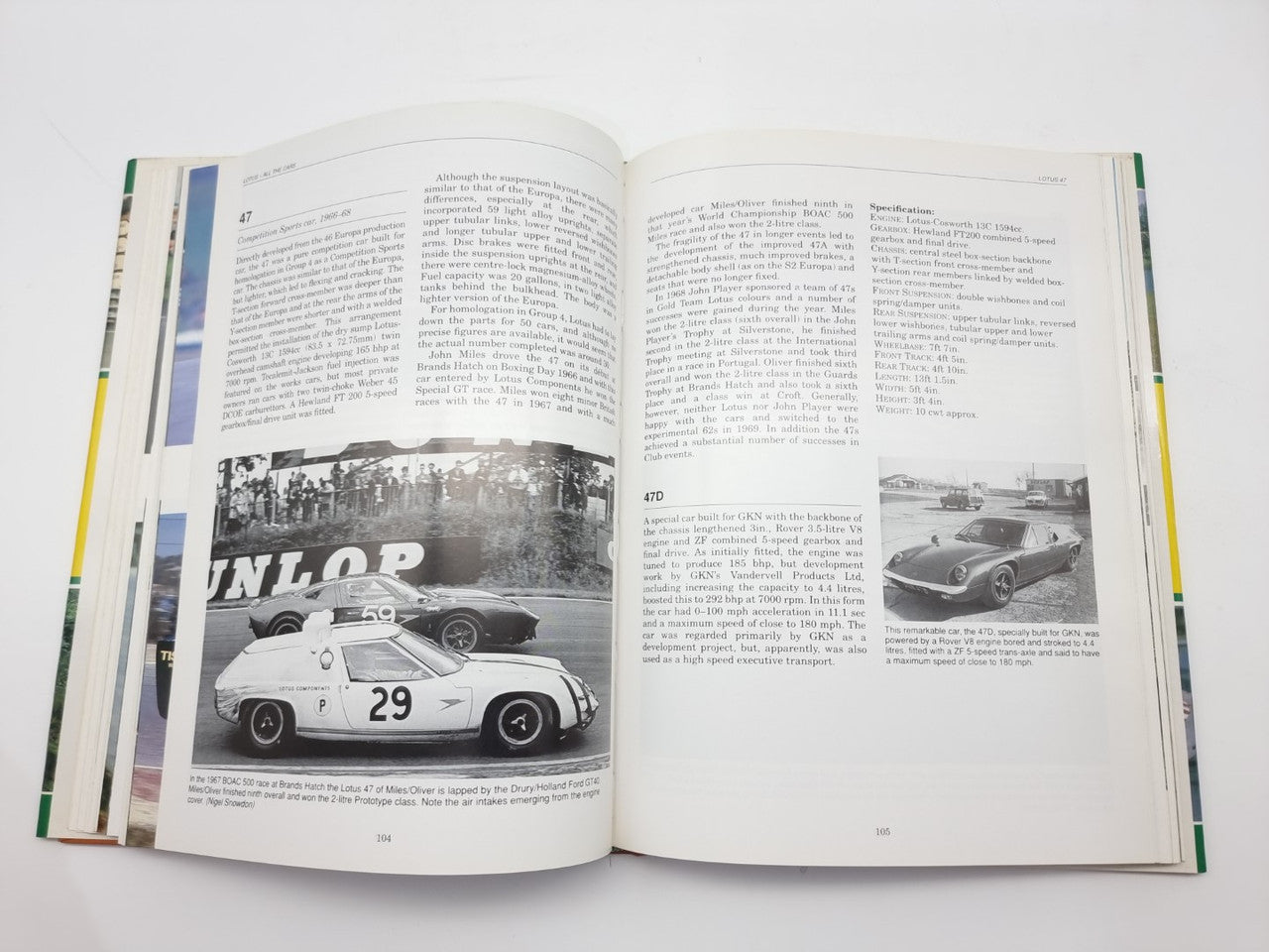 Open book with grayscale race car photo and printed captions across two pages