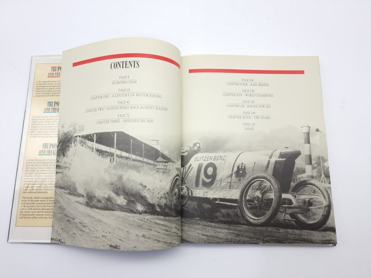 Motor racing book open to contents pages with grayscale racing car photograph