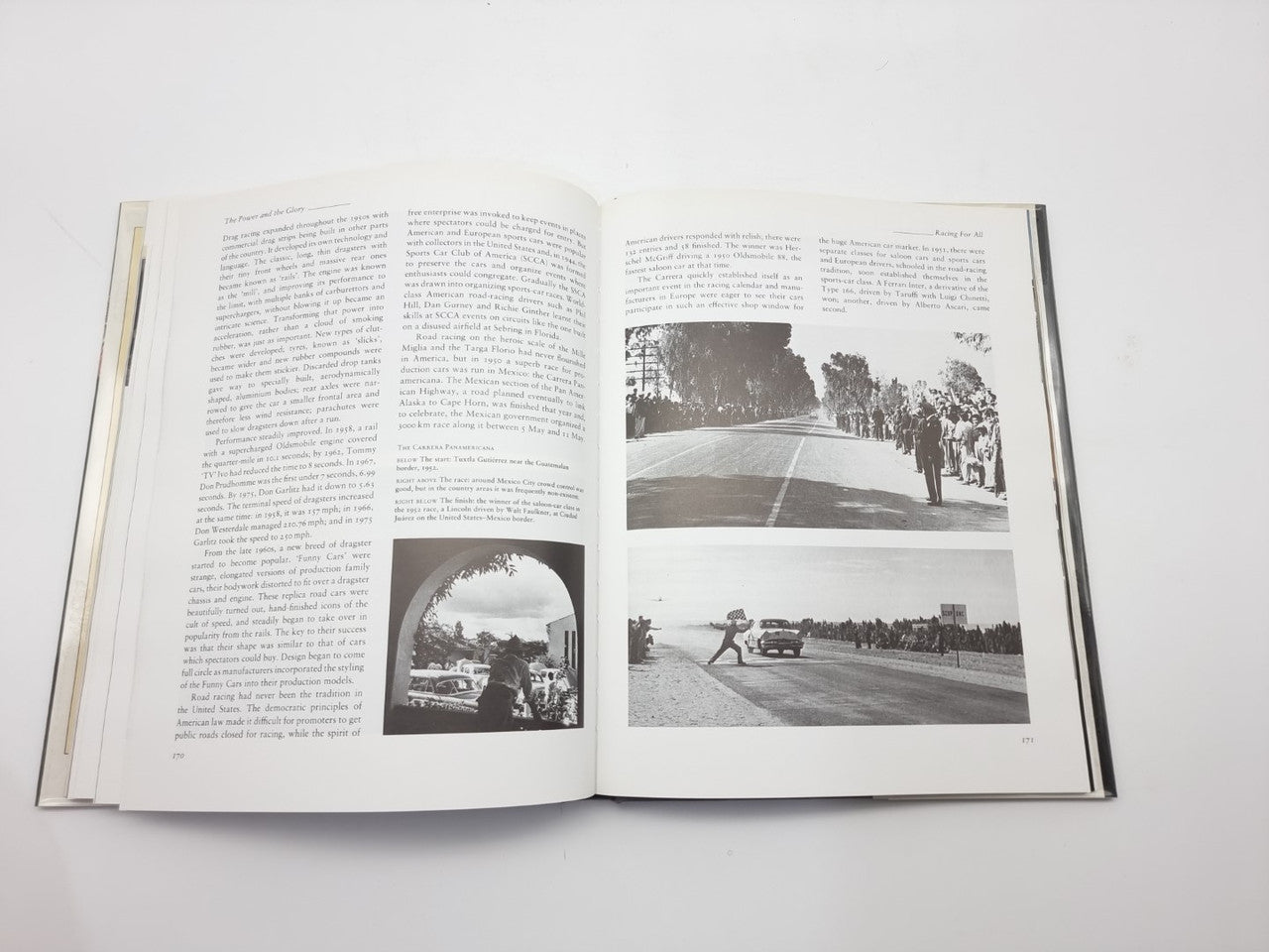 Open motor racing history book with vintage racing photos and dense text