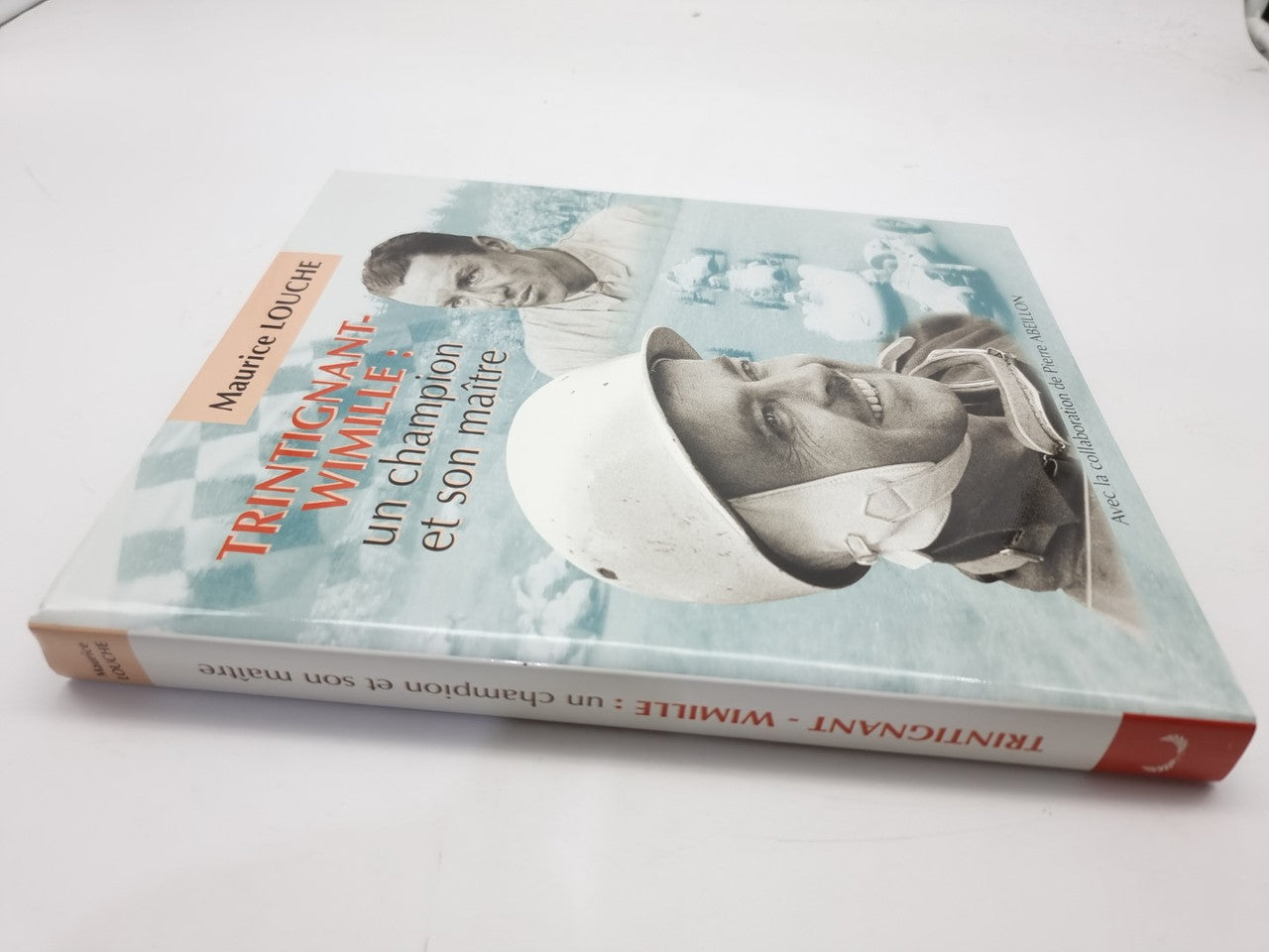 Racing biography book with illustrated front cover and close-up driver portrait