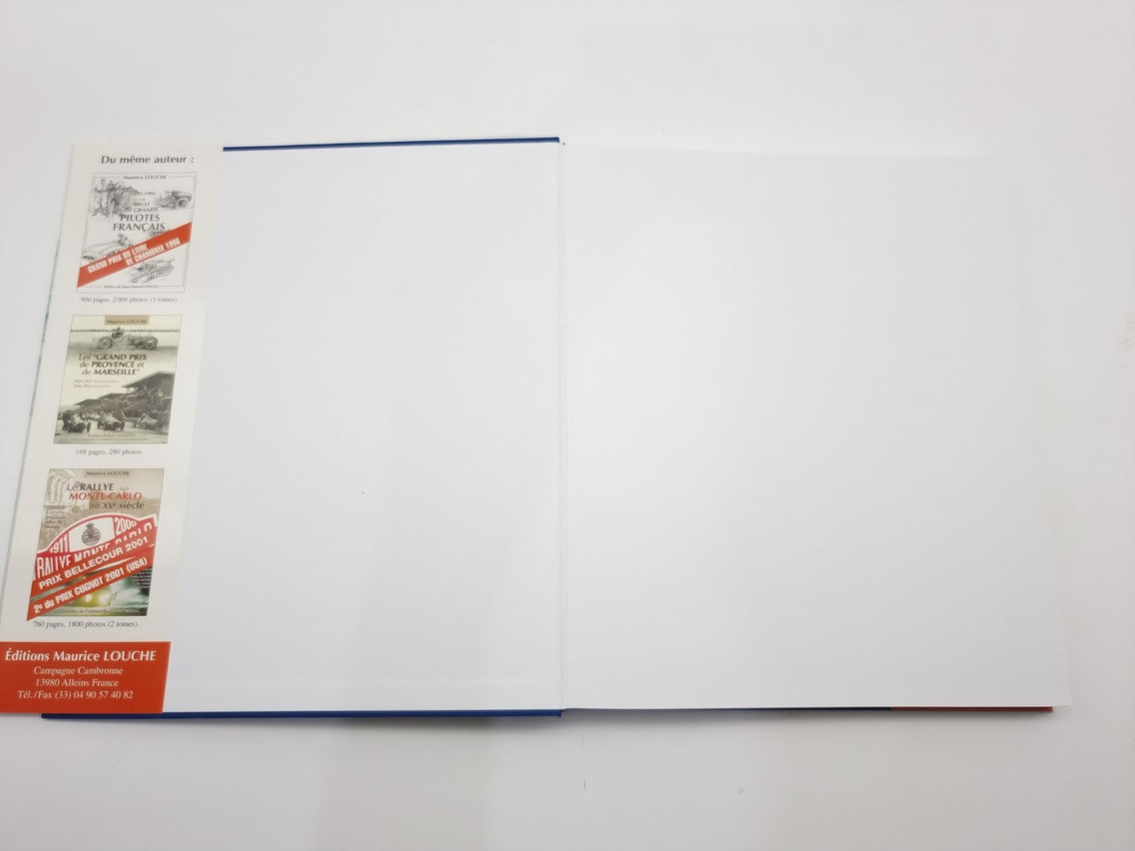 Racing biography book opened flat, showing inside pages and red-and-blue side panel