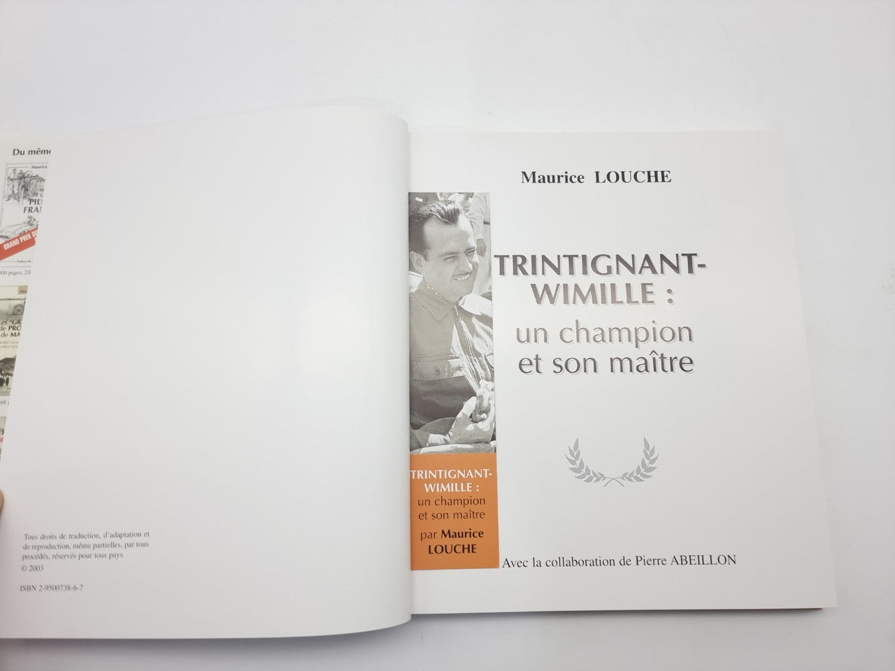 Racing biography book opened, with title page on right and blank page on left