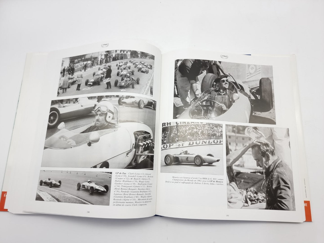 Racing photo book, open spread with black-and-white close-ups of race cars and drivers