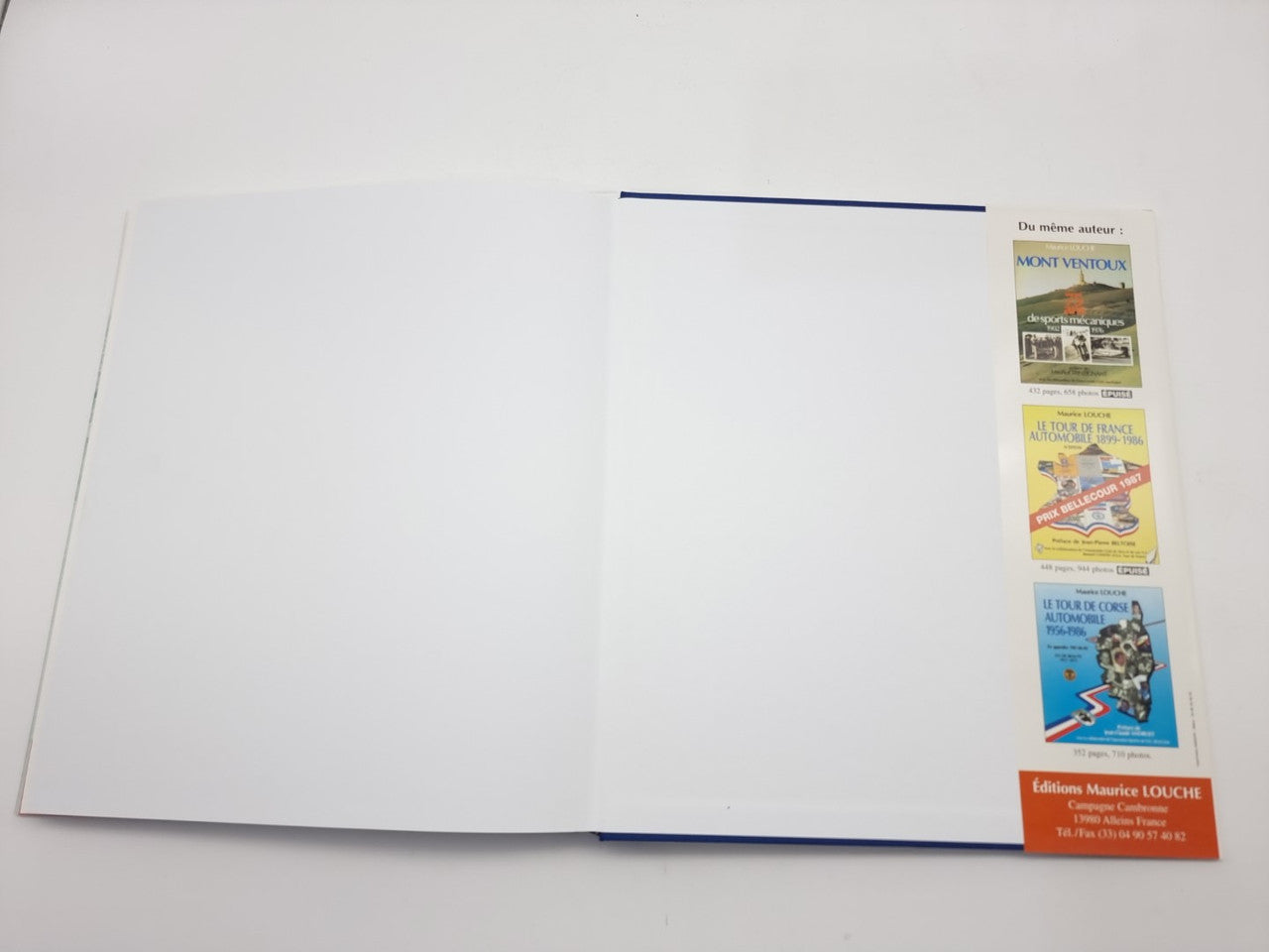 Racing photo book, open spread with blank page and right page with small text