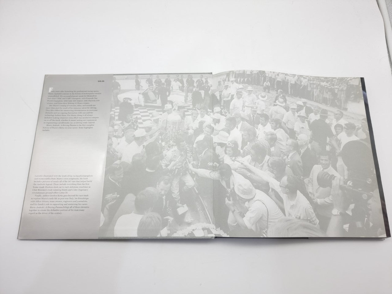 Racing book open to a spread with a crowd photo and a left-side text column