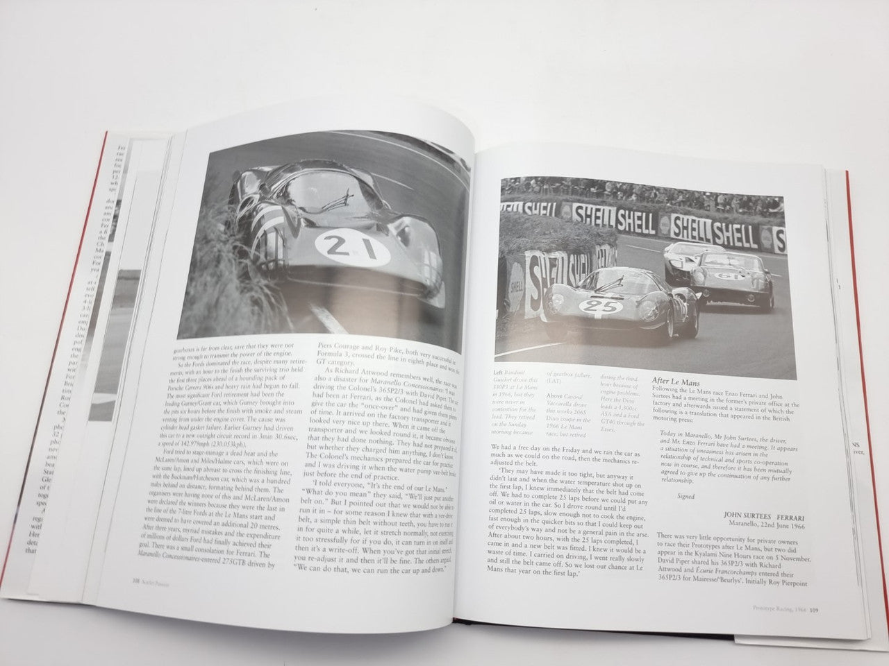 Open automotive history book featuring two black-and-white race car photo spreads