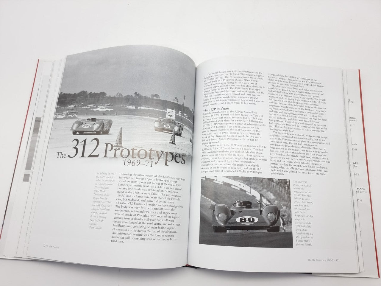 Open book spread with a car title section and black-and-white racing photo inset