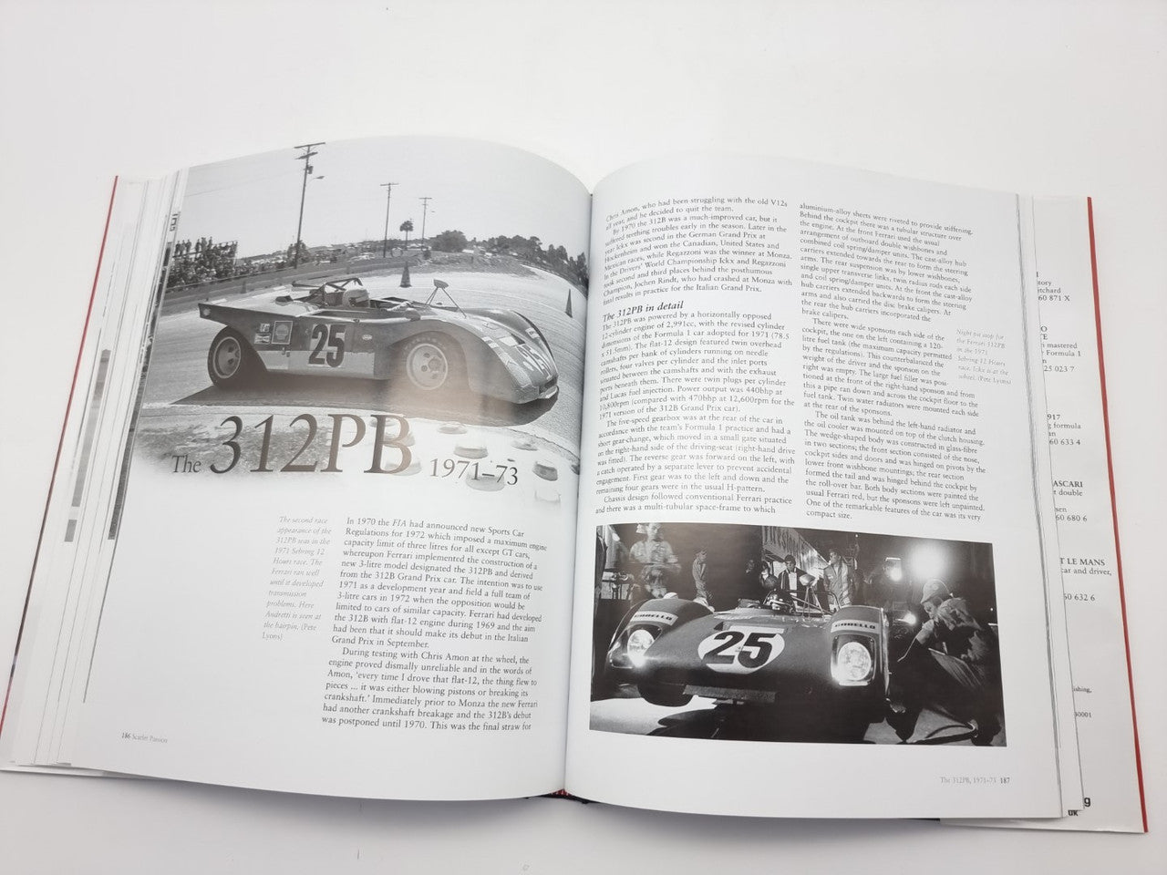 Open automotive history book with black-and-white racing car images and article text