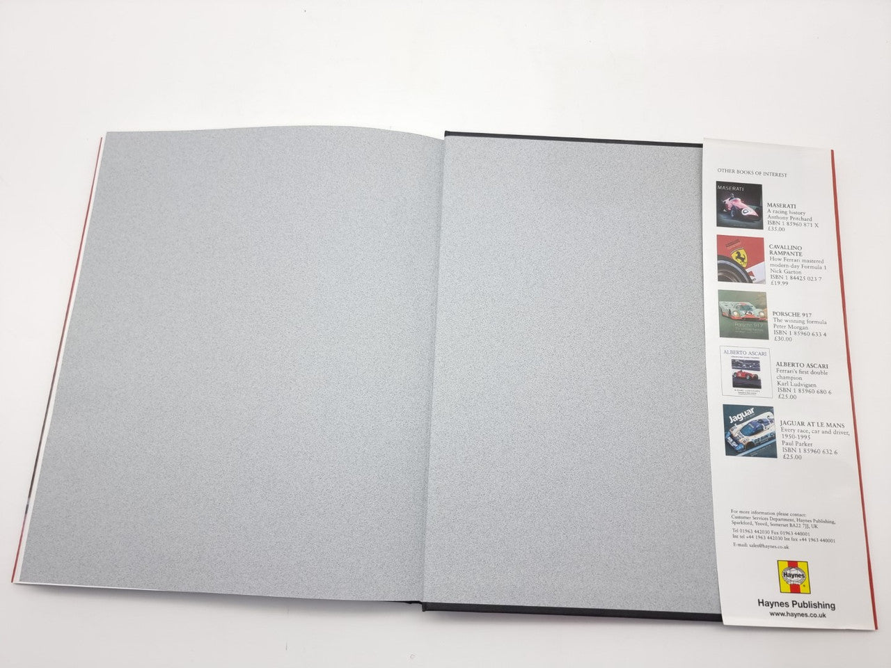 Open book with gray blank inner pages and printed side index strip