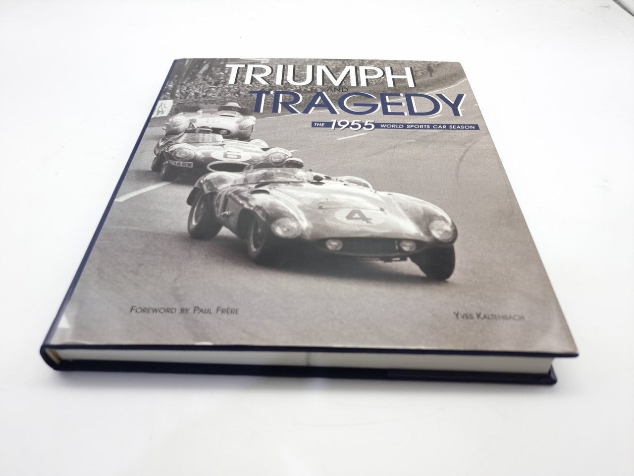 Hardcover book cover, Triumph and Tragedy 1955 title, race car photo