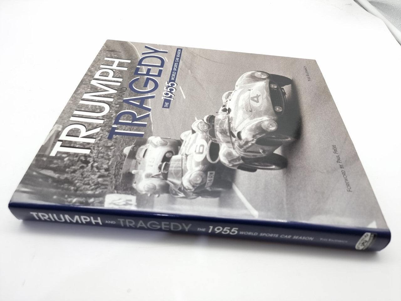 Book cover close-up with Triumph and Tragedy 1955 title and race car detail