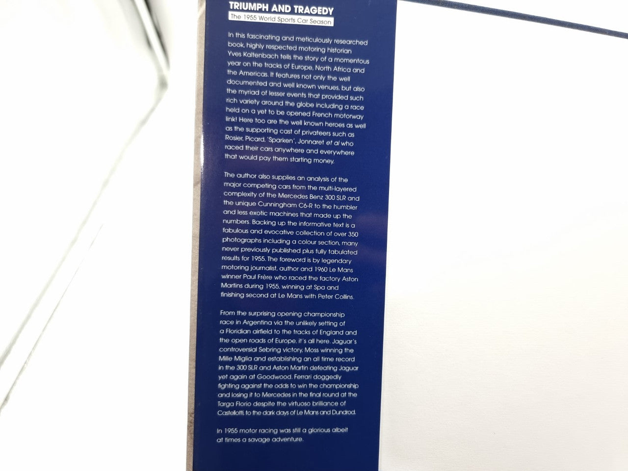 Open book page with blue header block and paragraphs of text