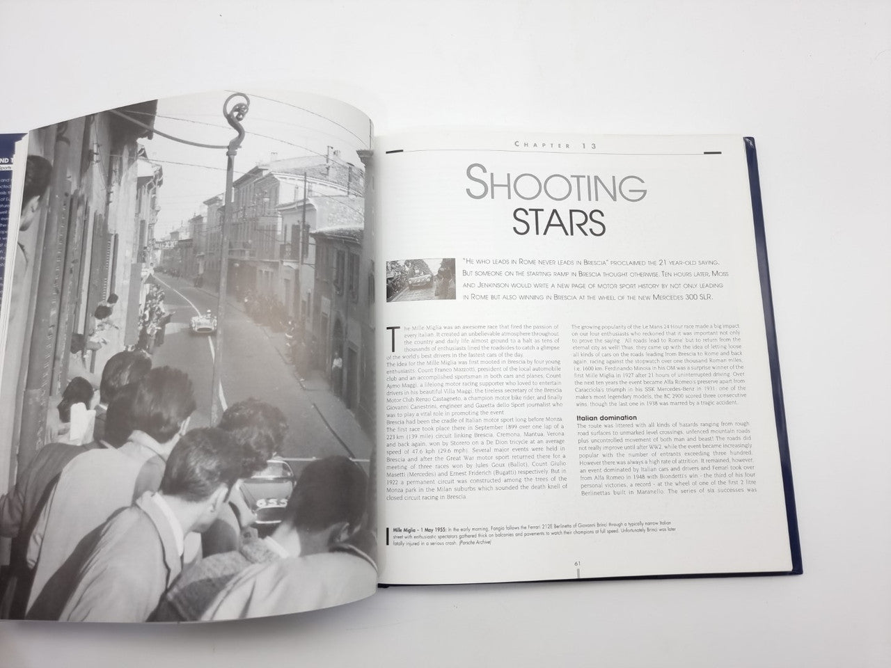 Open photo book spread with 'SHOOTING STARS' article and vintage car photos
