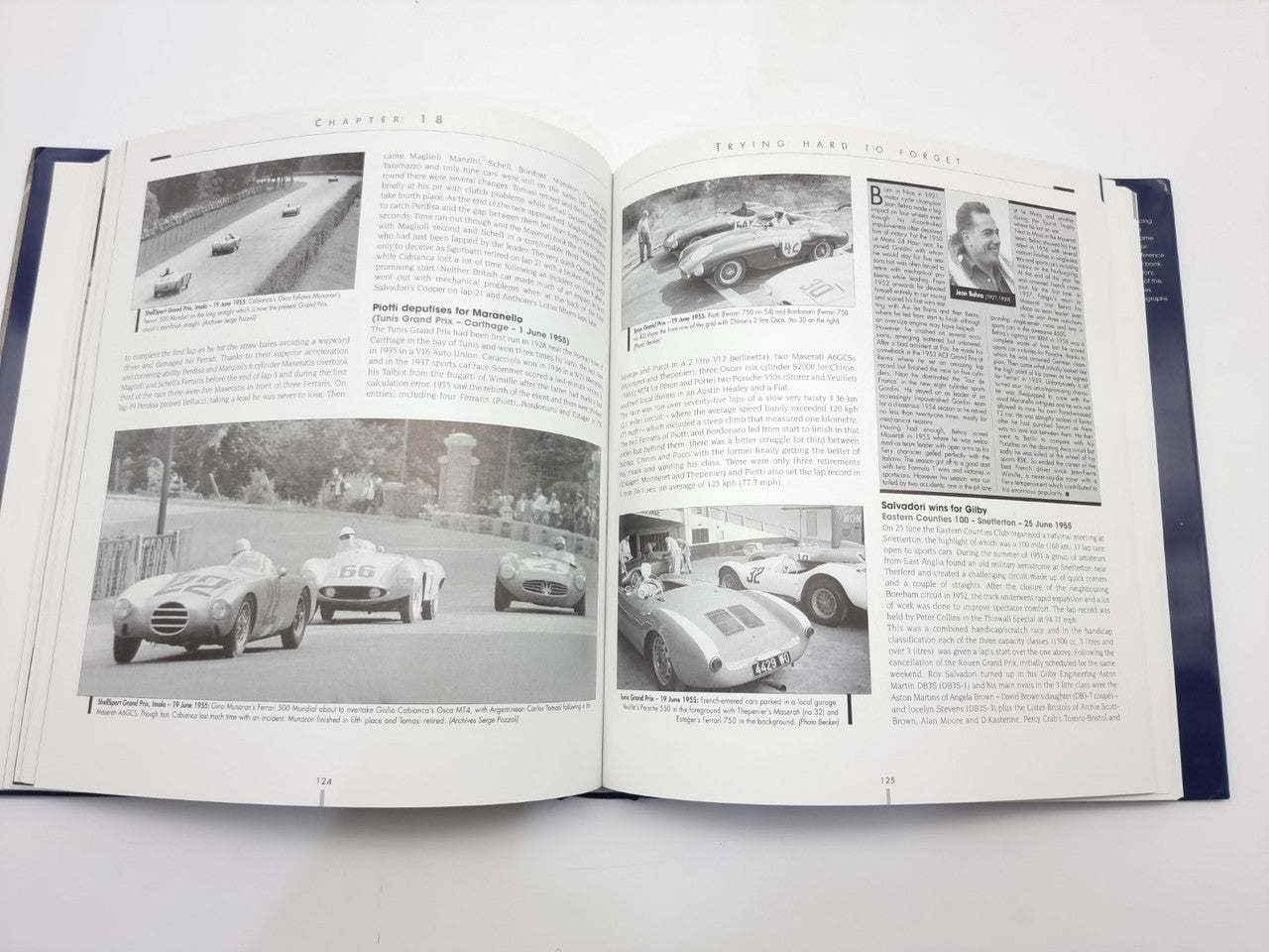 Open photo book spread with multiple vintage race car photos and article text