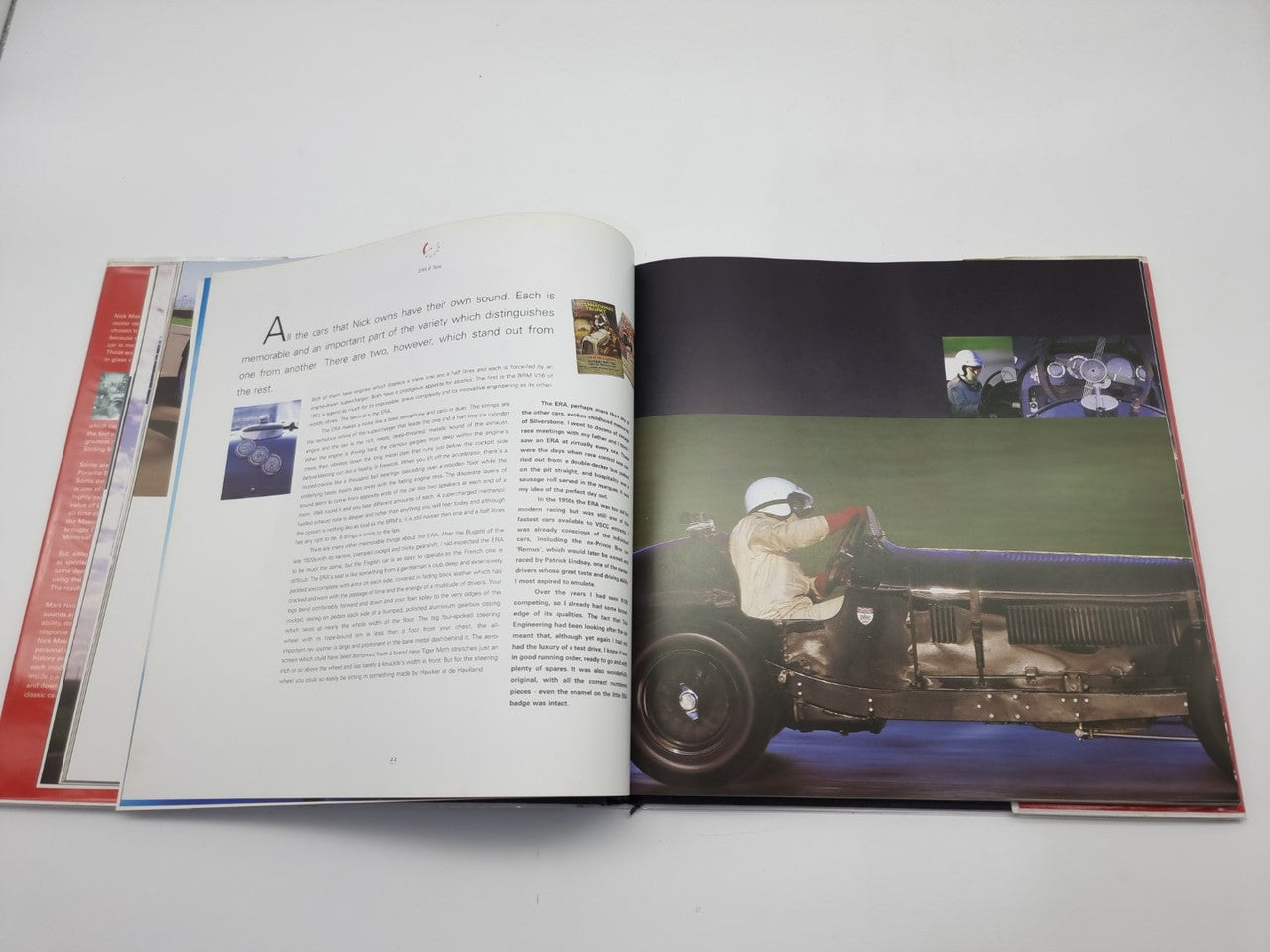 Open hardcover book with a race car photo on the right and text on the left pages