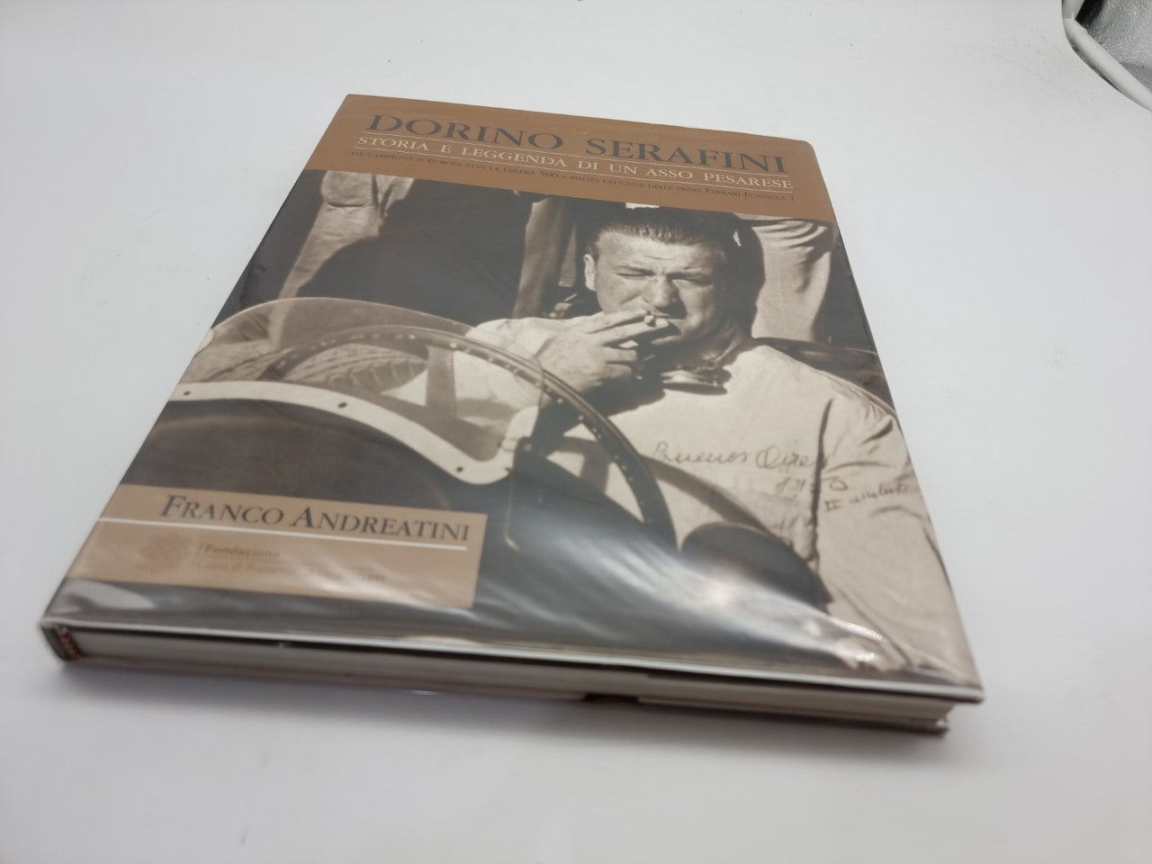 Dorino Serafini story-legend book, front cover with sepia portrait and title