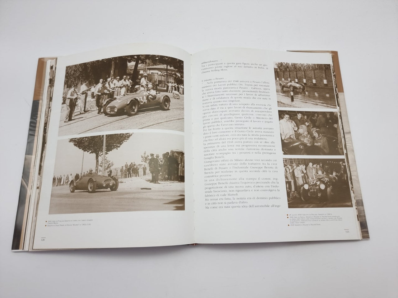 Dorino Serafini story-legend book, open spread with multiple sepia car photos and text