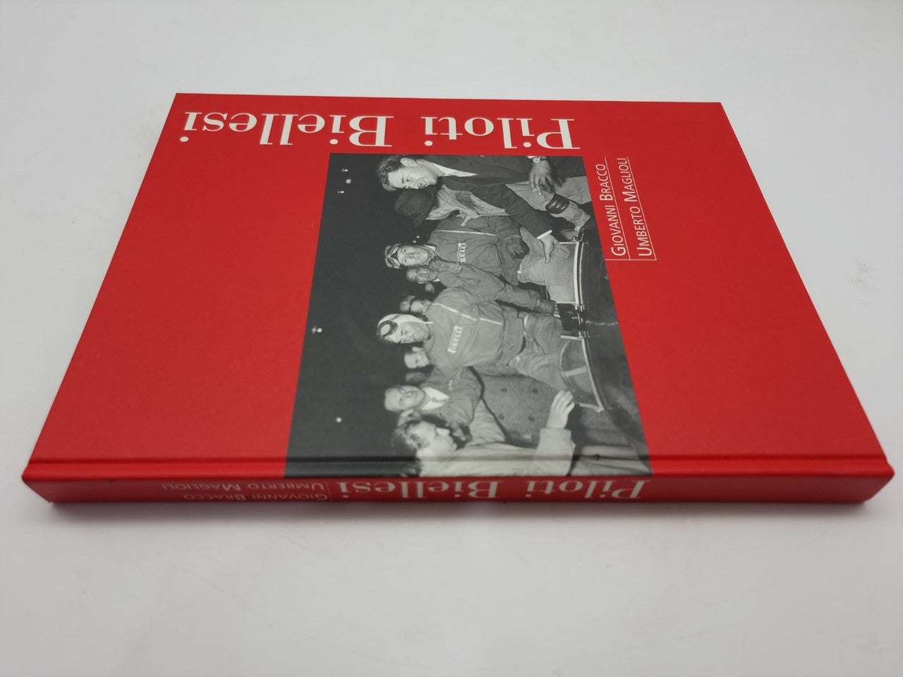 Red hardcover book cover with black-and-white team photo and white title text.