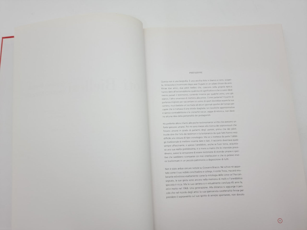 Open book with white pages and centered printed text.