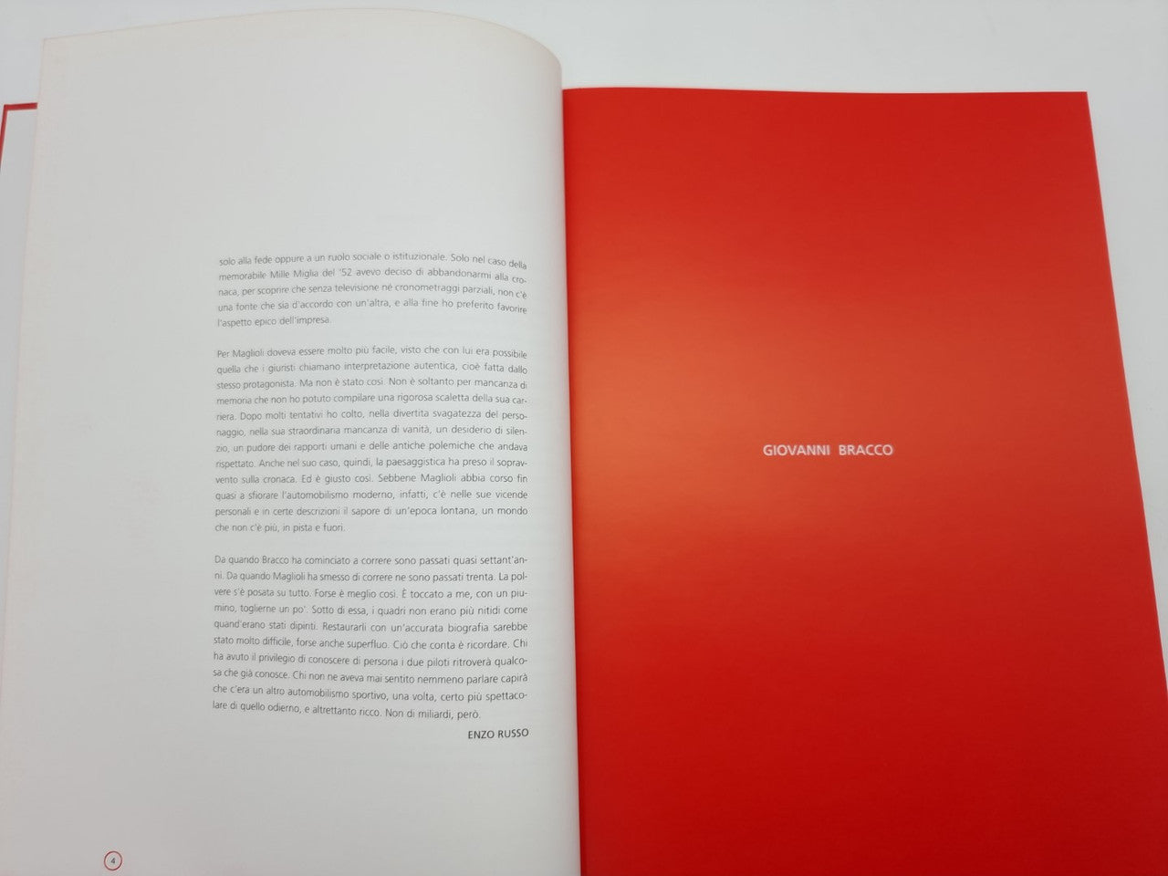 Open book with left text page and right full red page titled in white.