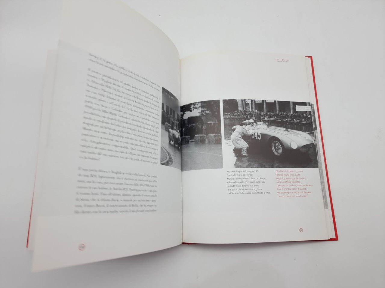 Open book with black-and-white race car photo on the right page and text on left.