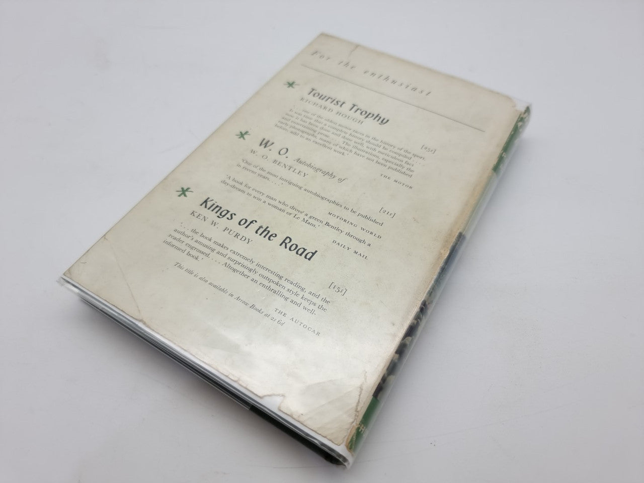Hardcover book with cream back cover and green title text