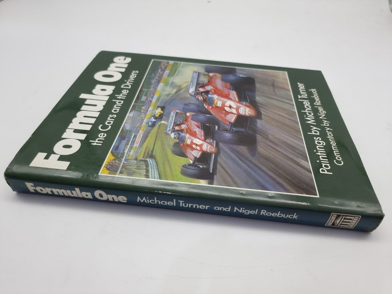 Formula One art book cover with racing cars artwork and signed spine text