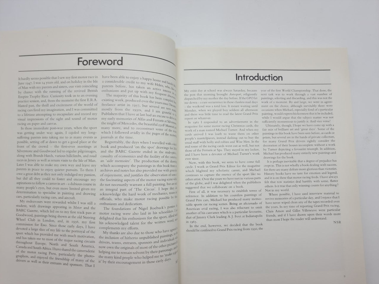 Open Formula One art book showing Foreword and Introduction pages with text