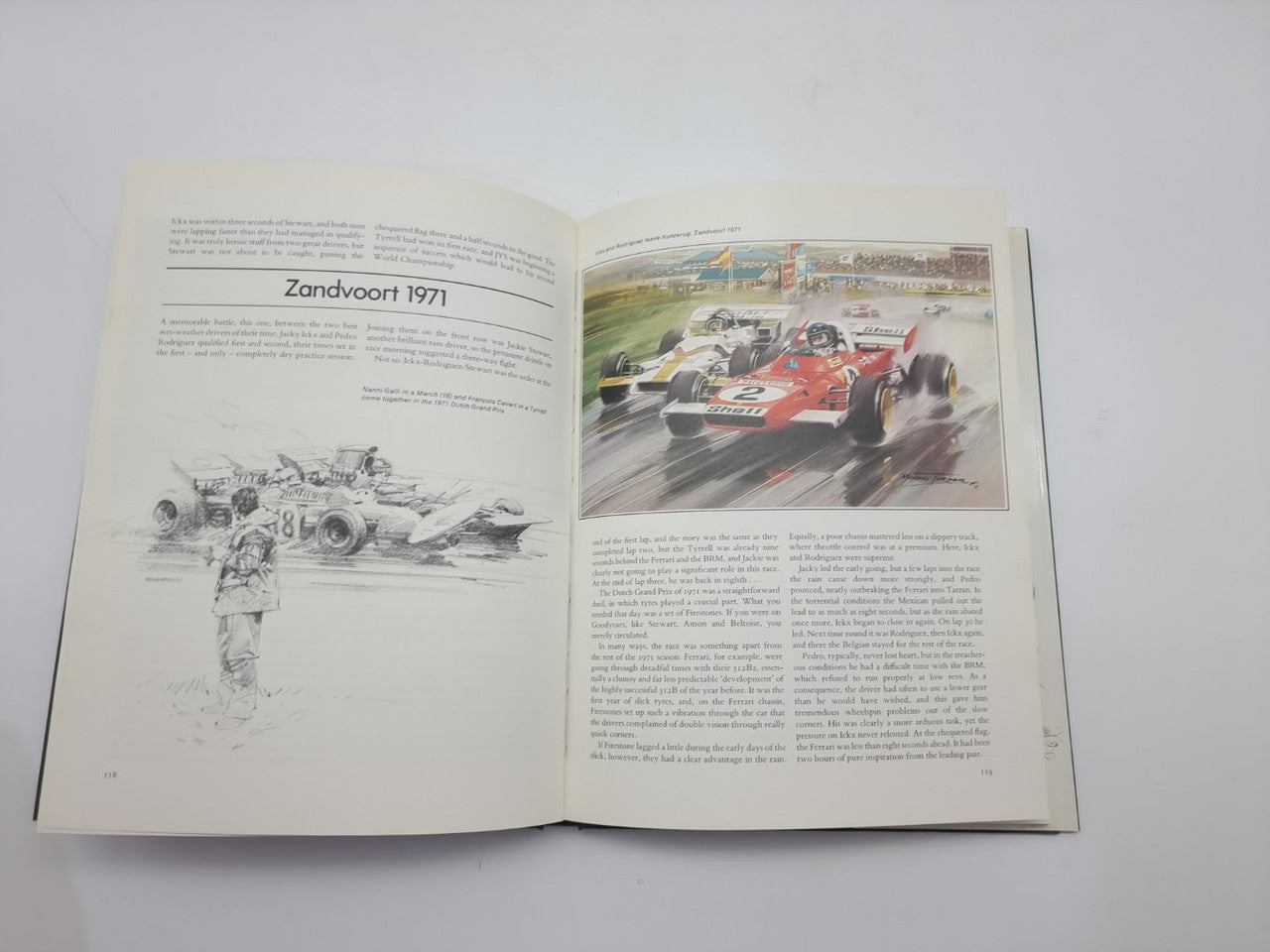 Open Formula One art book with Zandvoort 1971 racing car artwork on right