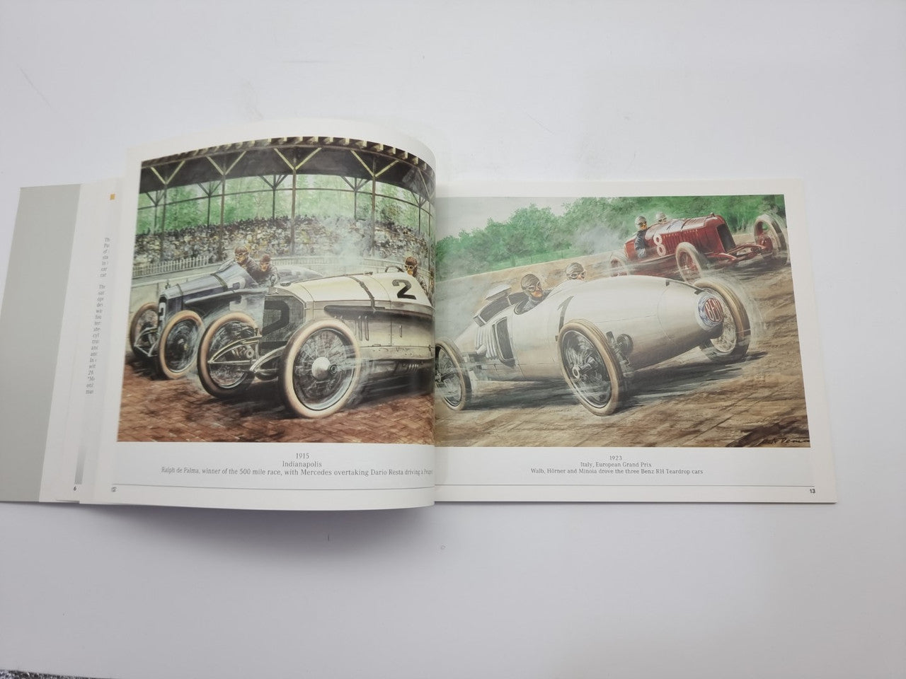 Motorsport history book open spread with two vintage race car photos side by side.