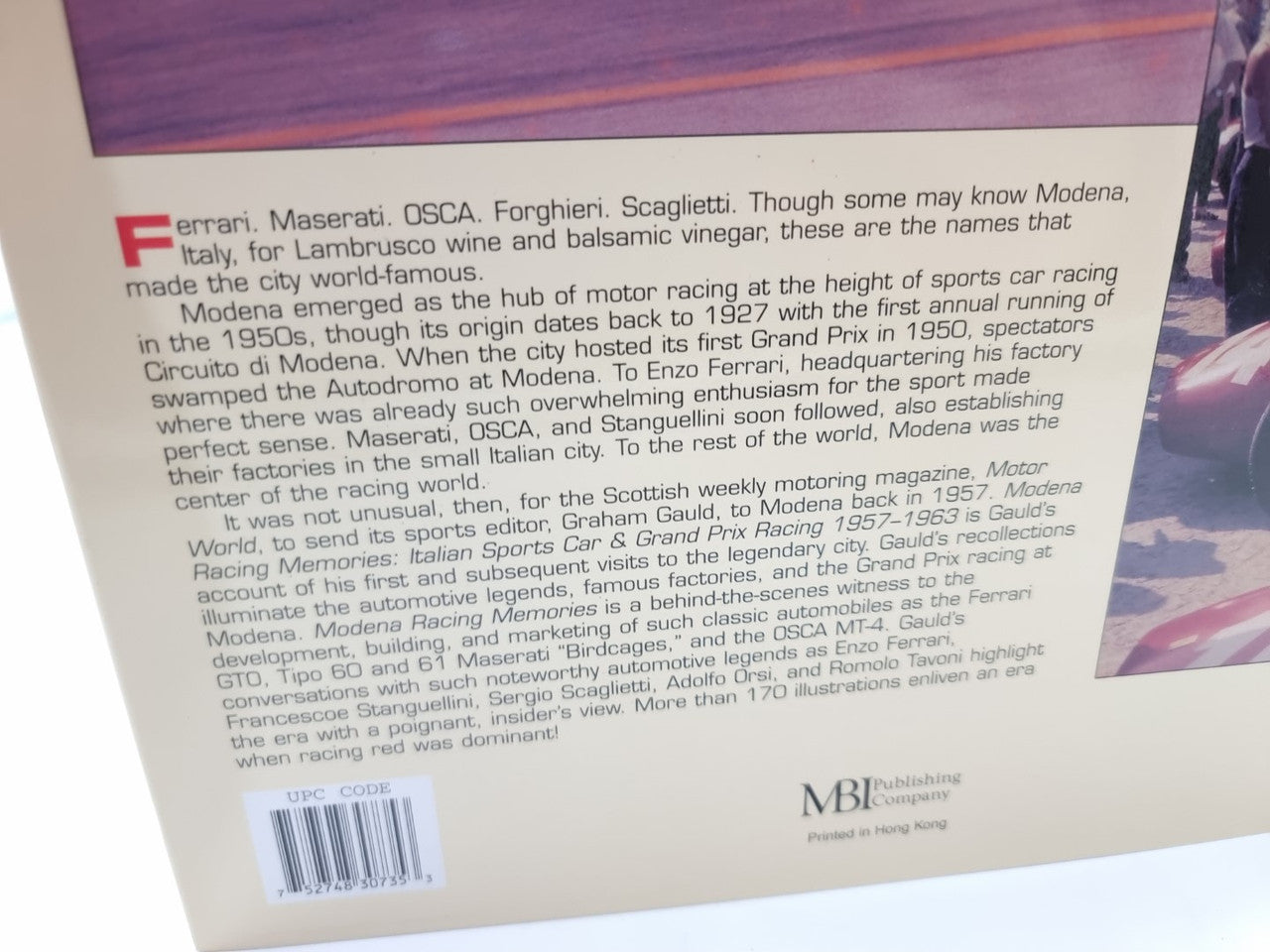 Book back cover close-up with printed description text and small barcode at bottom