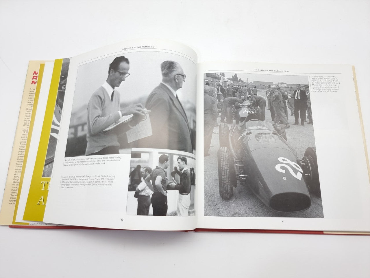 Open racing book with black-and-white images of people and vintage race cars