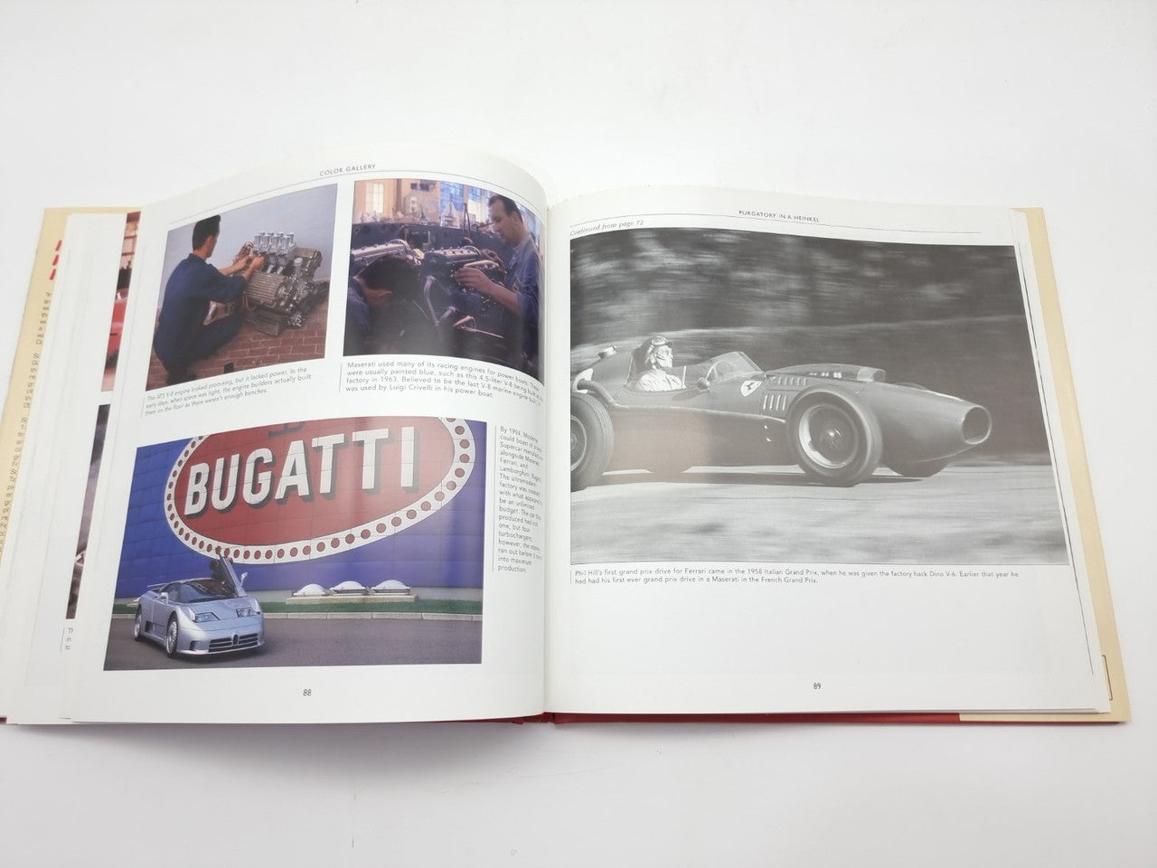 Open racing book with 'BUGATTI' logo page and black-and-white race car photo