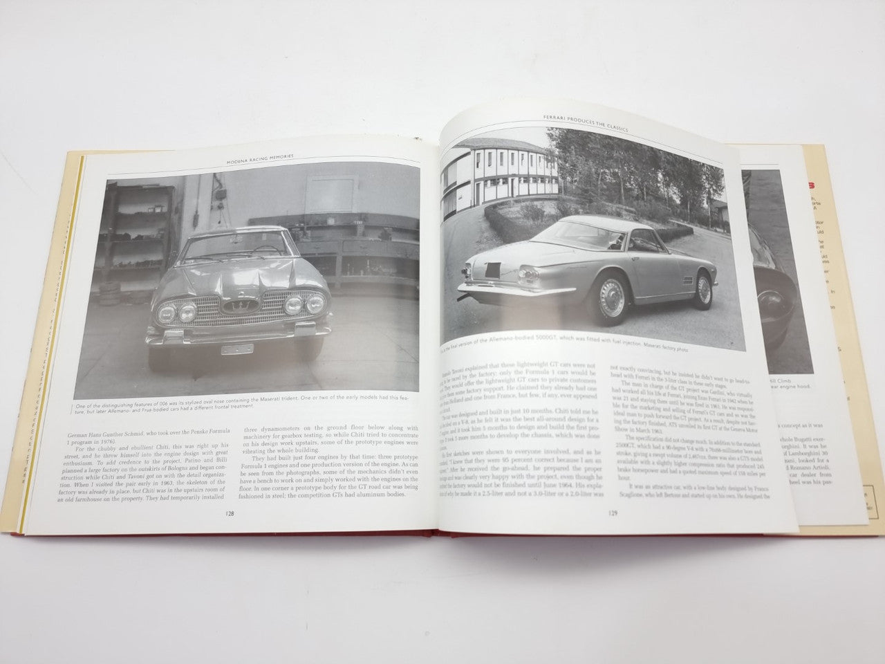 Open racing book with front-view black-and-white car photos on facing pages