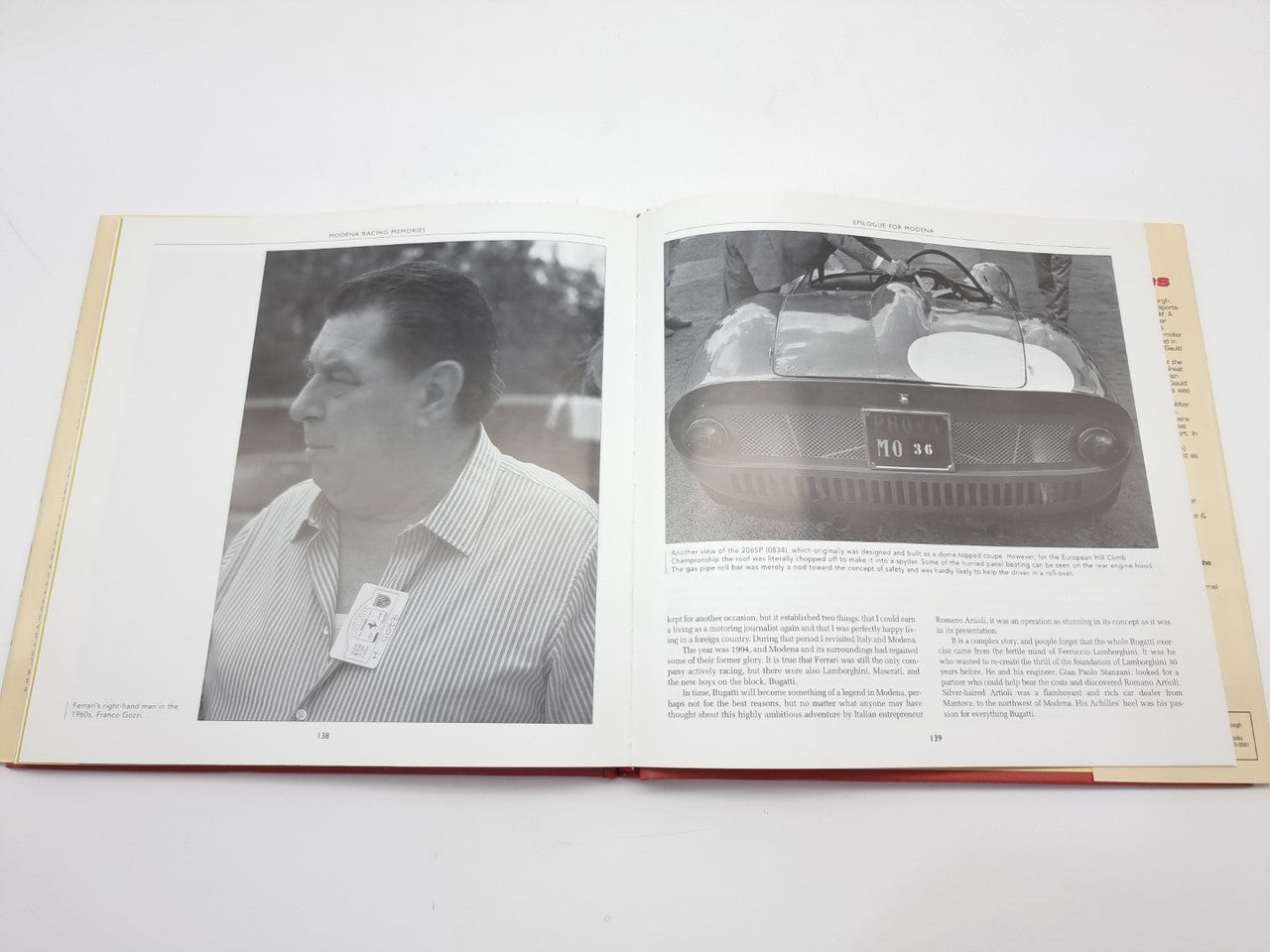 Open racing book with portrait photo and close-up of a vintage race car