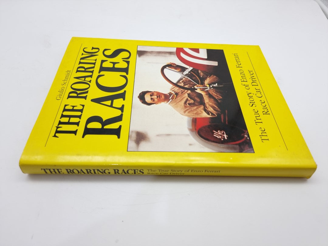 Closed yellow hardcover book with race car driver cover photo and bold lettering