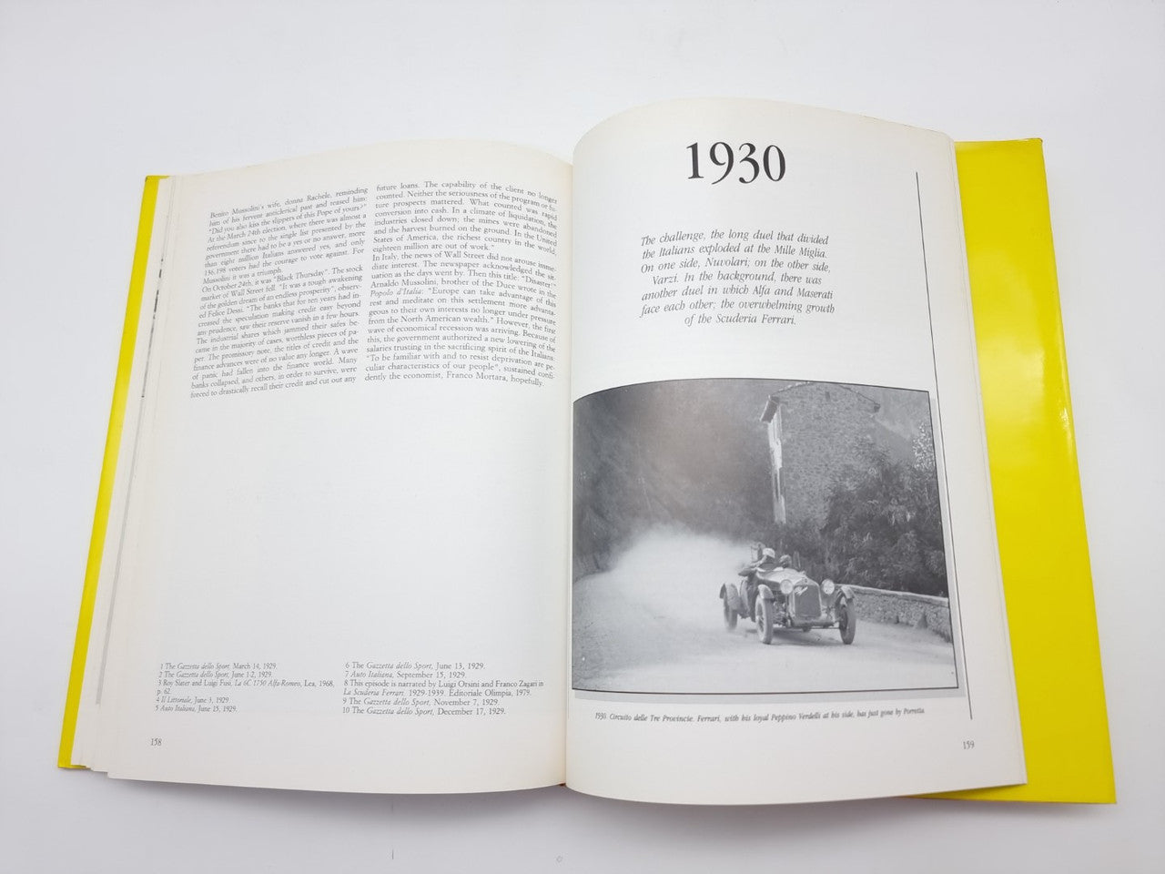 Open hardcover book with a visible year heading and black-and-white race photo