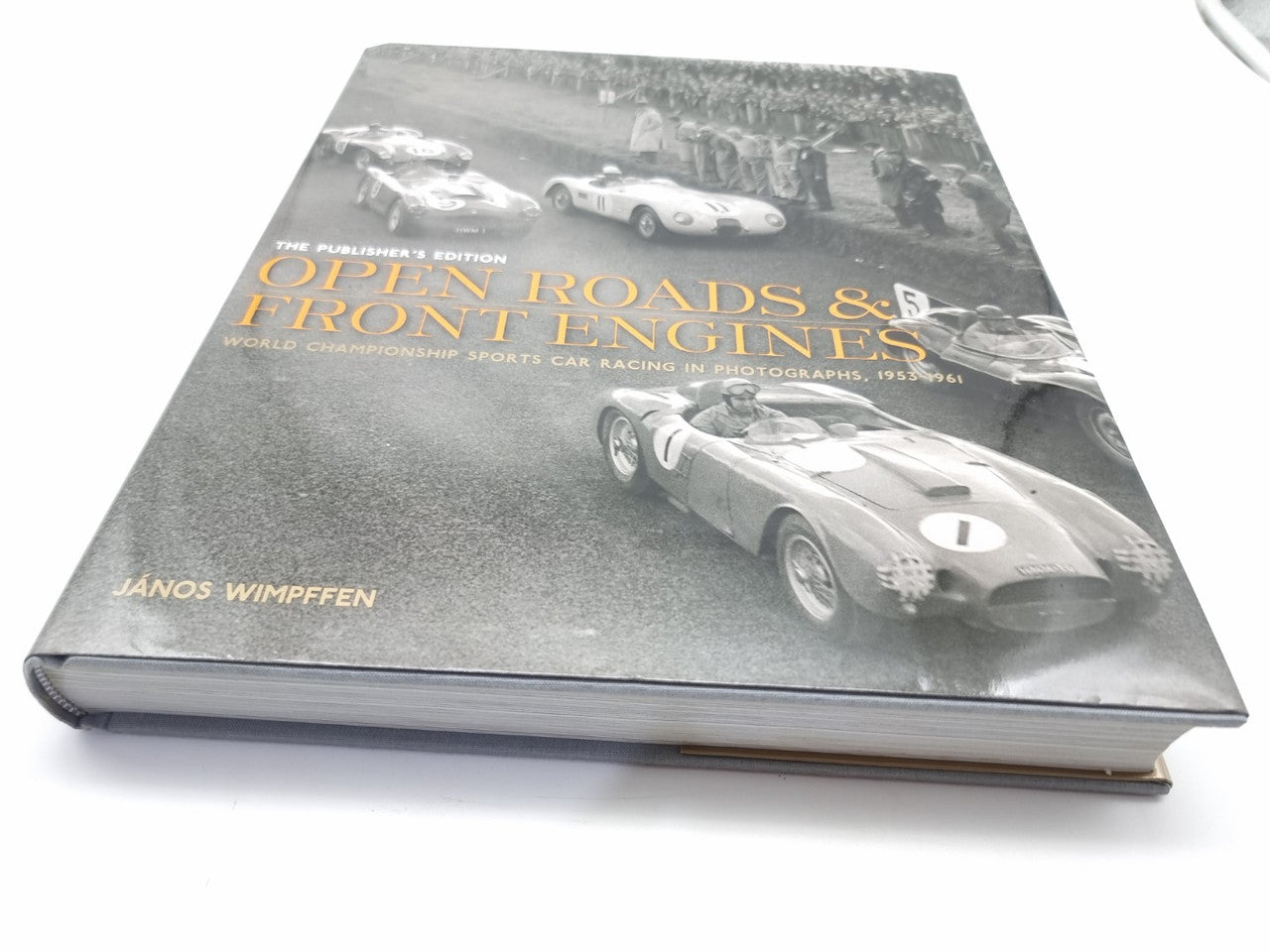 Signed hardcover book with vintage race car photo cover and title text