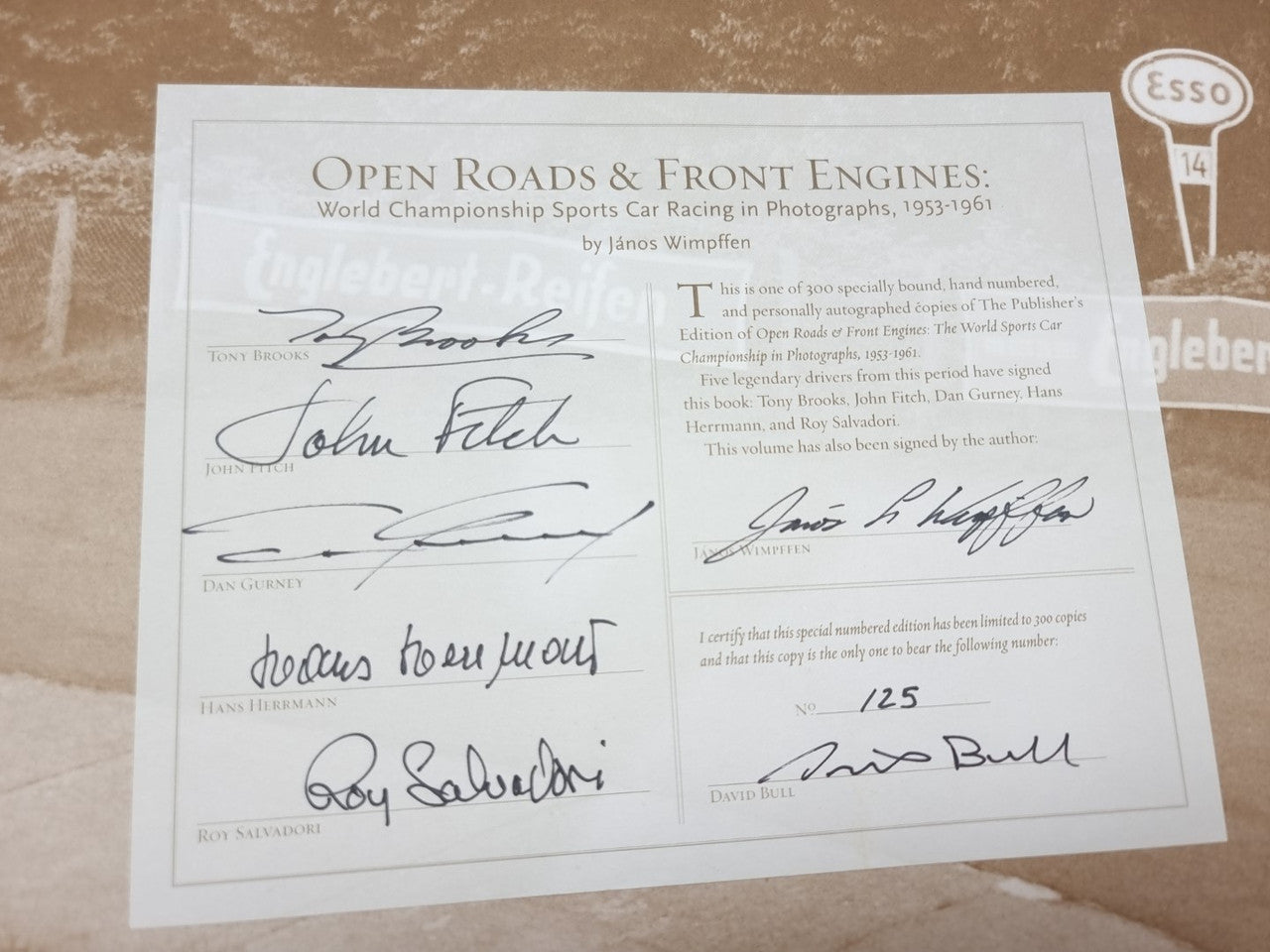 Close-up of signed book pages with multiple handwritten signatures