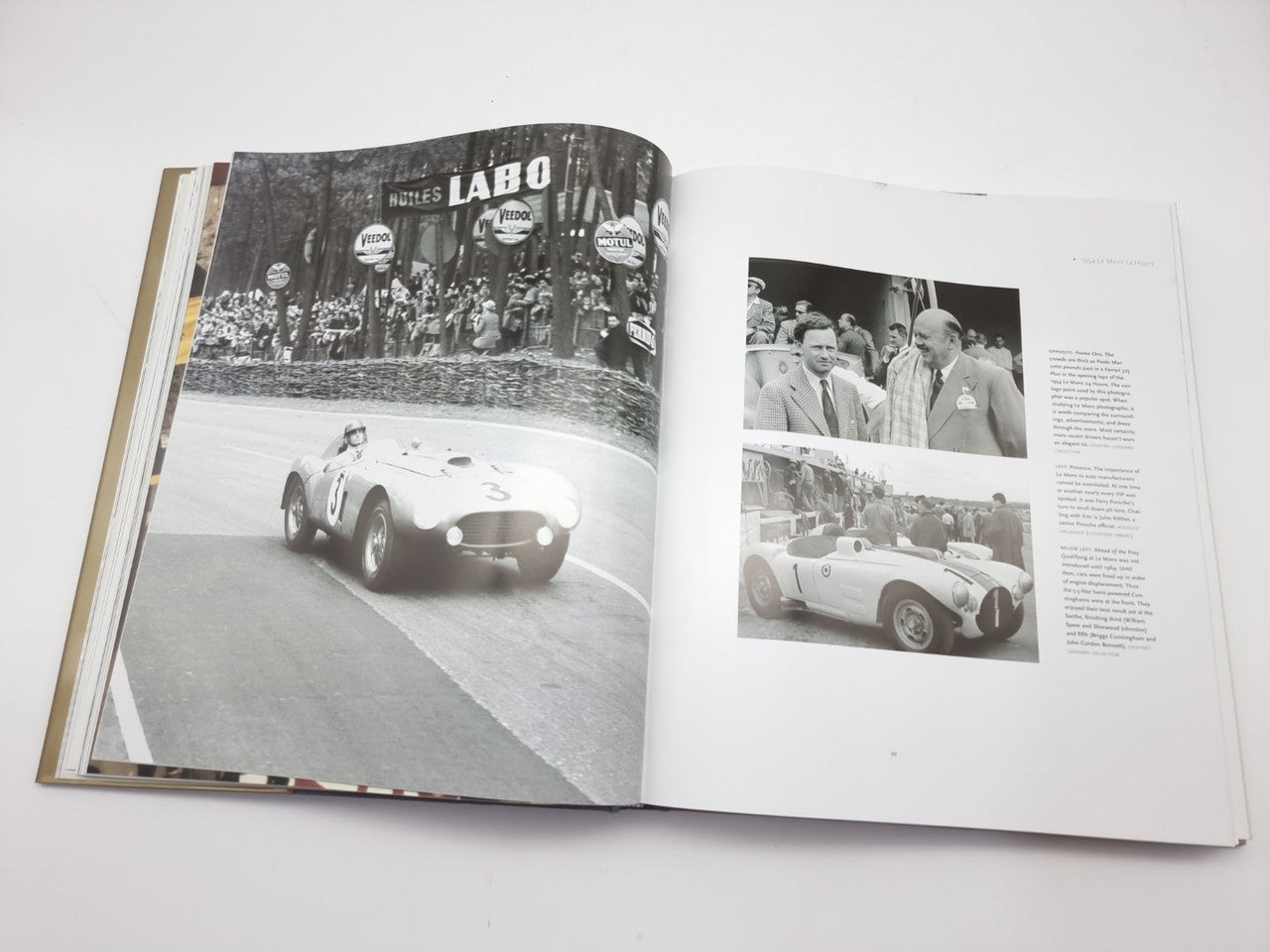 Open book spread with classic race cars on track and crowd photo inset.