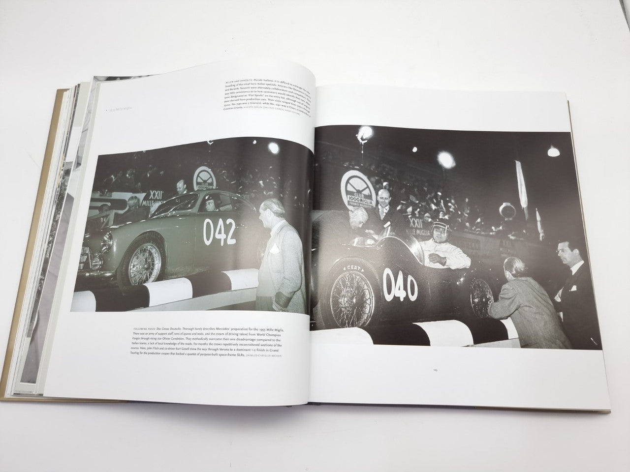 Open book spread with nighttime race cars numbered 042 and 040.