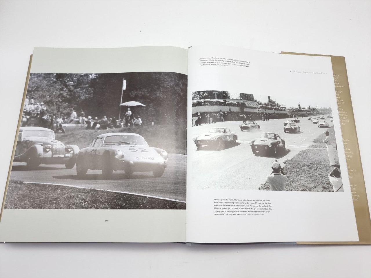 Open hardcover book with black-and-white photos of classic cars on two spread pages
