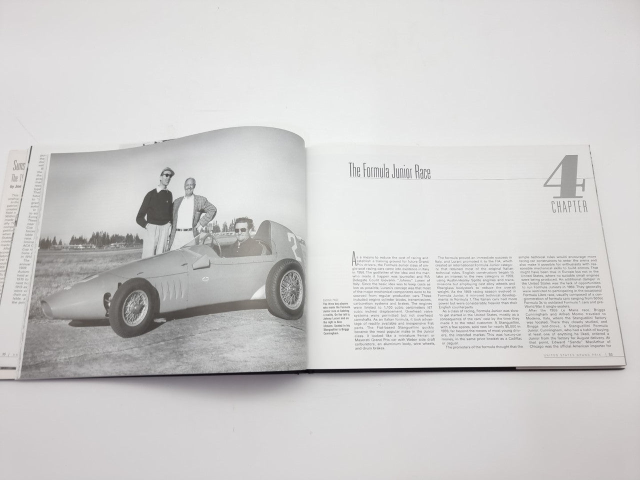 Vintage racing book open showing a driver by a vintage race car and chapter text