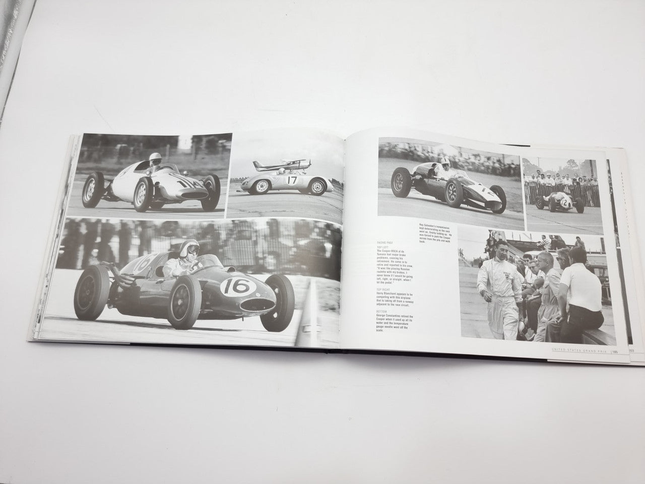 Vintage racing book open with four black-and-white car photos and body text