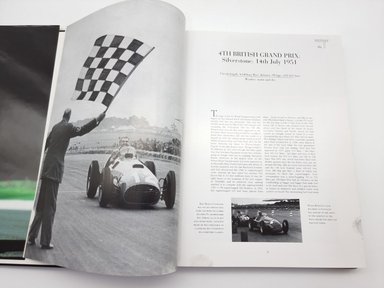 Ferrari F1 victories book, open spread with checkered-flag photo and race text