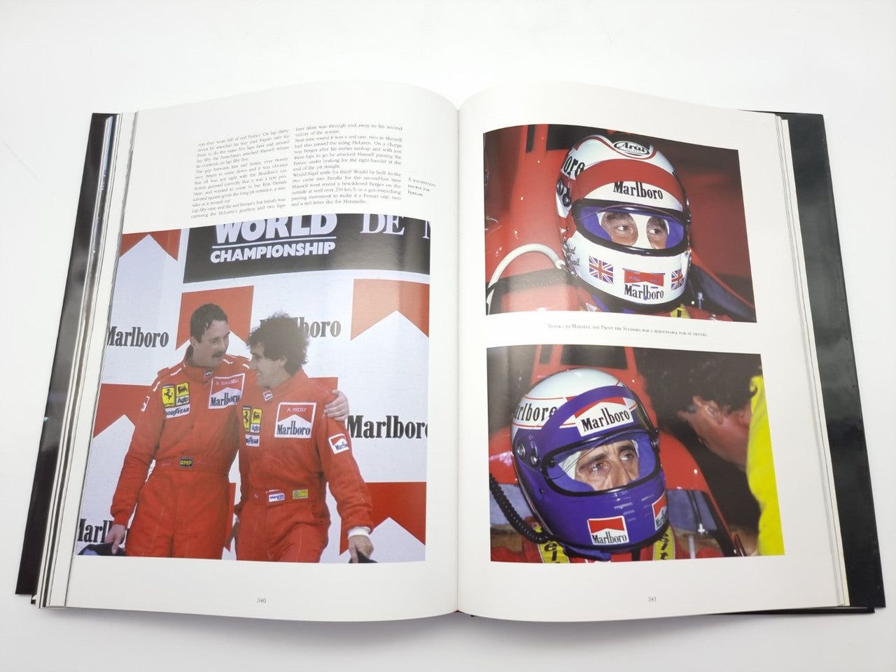 Open motorsport book with driver portrait close-ups in racing helmets