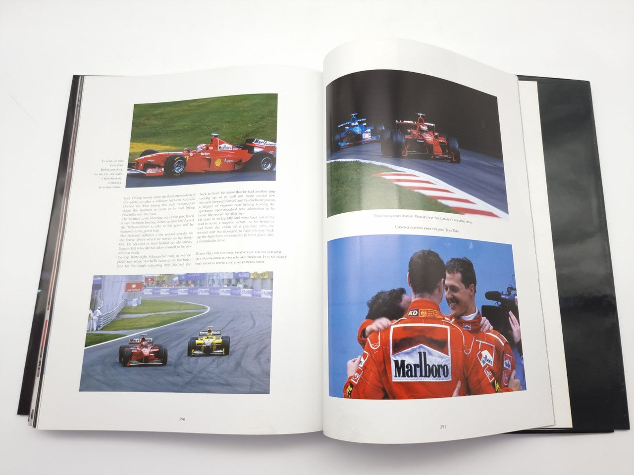 Ferrari F1 victories book, open spread with racing photos and driver portrait