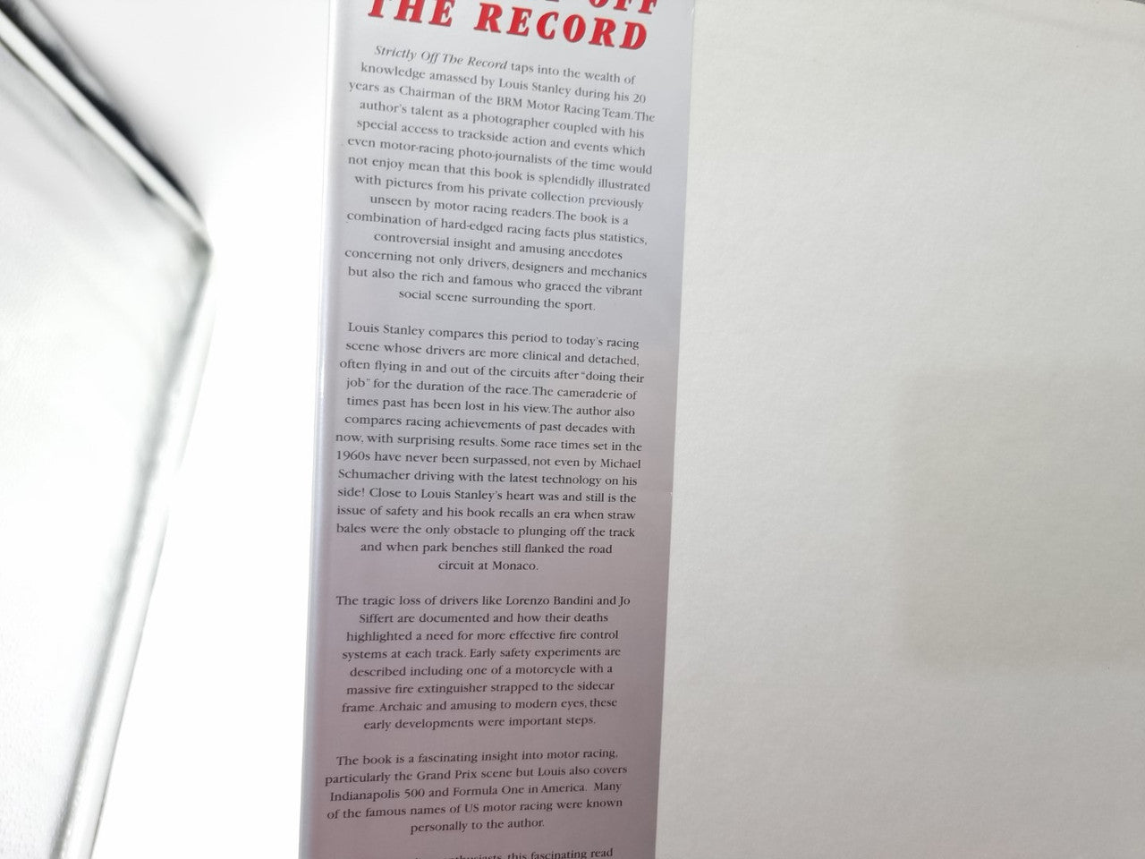 Racing history book page close-up with dense printed text