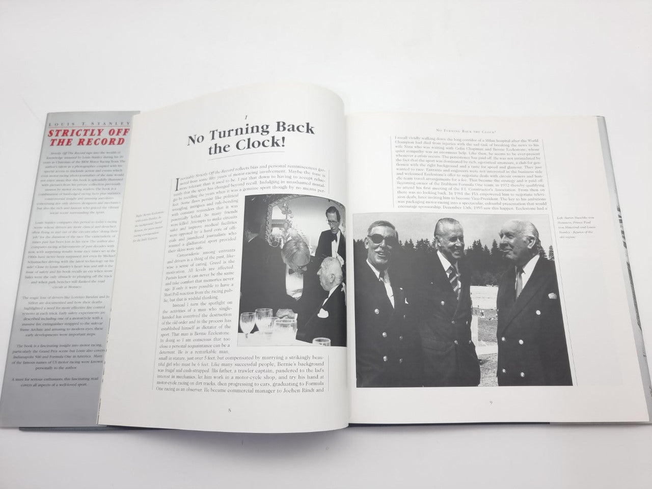 Racing history book open with two text sections and black-and-white photo inserts