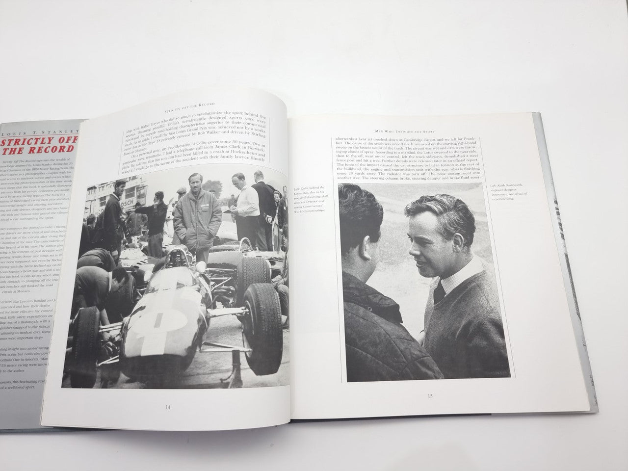 Racing history book open with black-and-white team and portrait photos